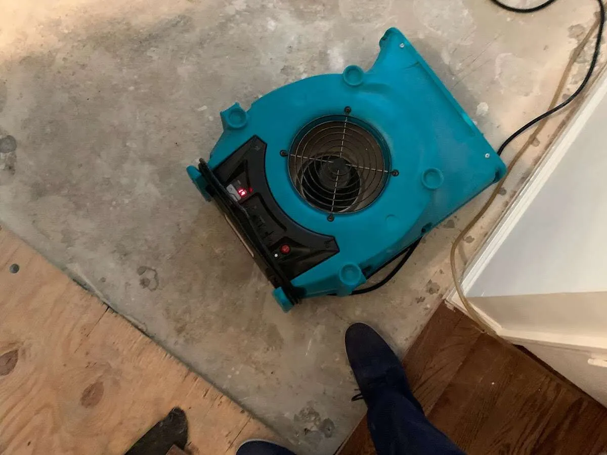 Air mover drying subfloor during Commercial Water Damage Restoration in Baldwin Park
